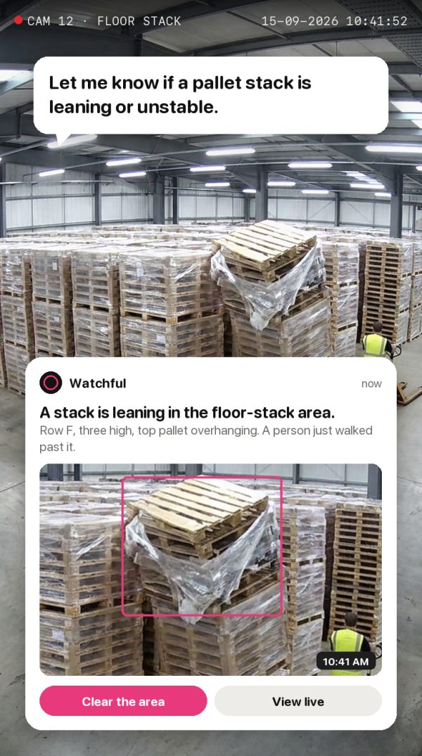 Let me know if a pallet stack is leaning or unstable. Alert: a stack is leaning in the floor-stack area.
